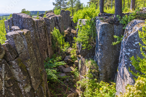 Ravine with rock pillar on a mountain photo