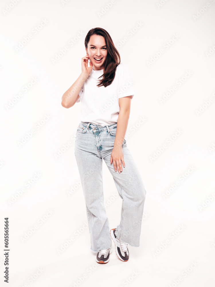 Young beautiful woman. Trendy carefree model in casual summer white T-shirt and blue jeans. Positive female isolated on white in studio. Cheerful and happy. Copy space, mockup. Full length Young beautiful woman. Trendy carefree model in casual summer white T-shirt and blue jeans. Positive female isolated on white in studio. Cheerful and happy. Copy space, mockup. Full length