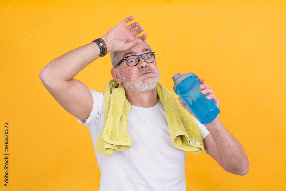 exhausted athletic mature man drinking water exhausted athletic mature man drinking water