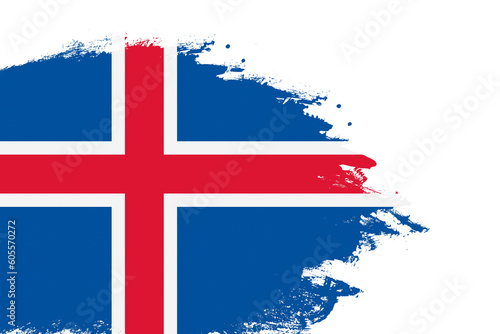 Iceland flag on a stained stroke brush painted isolated white background with copy space