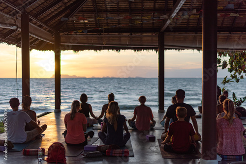 meditation by the sea at sunset, yoga as a healthy lifestyle, a journey into yourself © Aleksandr Lavrinenko