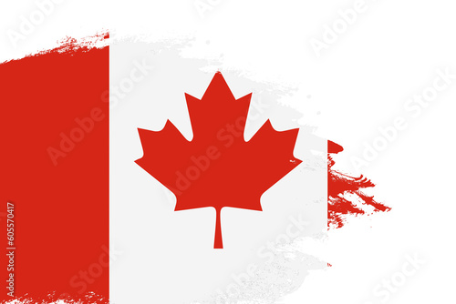 Canada flag on a stained stroke brush painted isolated white background with copy space