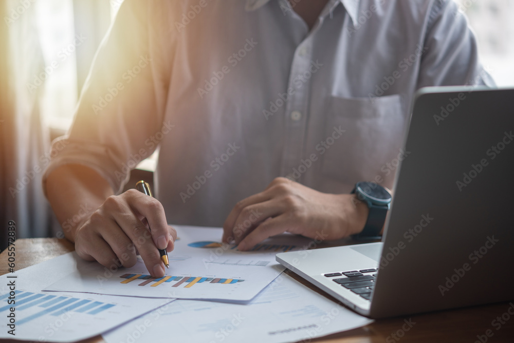 Businessperson report graph analysis marketing and paperwork chart finance investment strategy with laptop computer. Businessperson report graph analysis marketing and paperwork chart finance investment strategy with laptop computer.