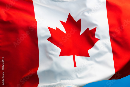Canada flag waving on blue background