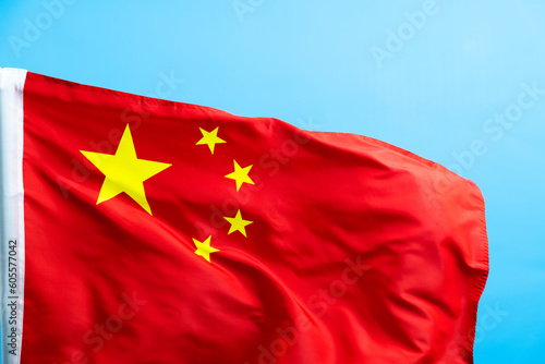 Chinese flag waving on blue background