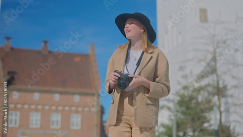 a girl taking photo in the city