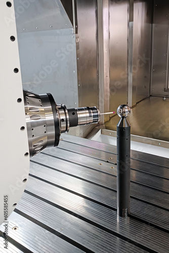 the process of calibrating a laser probe on a CNC machine