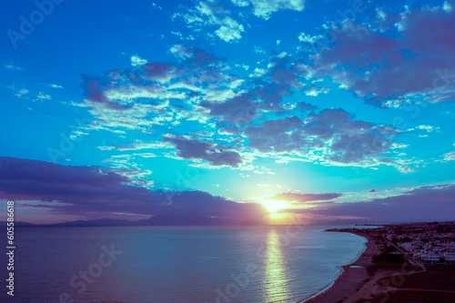 View of above of seascape with mountains at sunset. Rockies in the evening. View of Mount Olympus on the horizon. Beautiful nature of Greece
