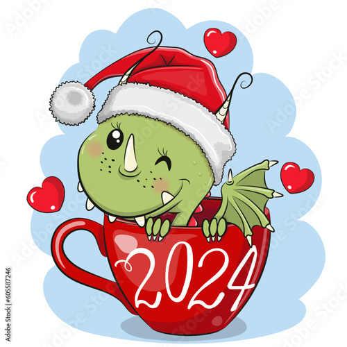 Cartoon Dragon in a Santa hat is sitting in a Cup