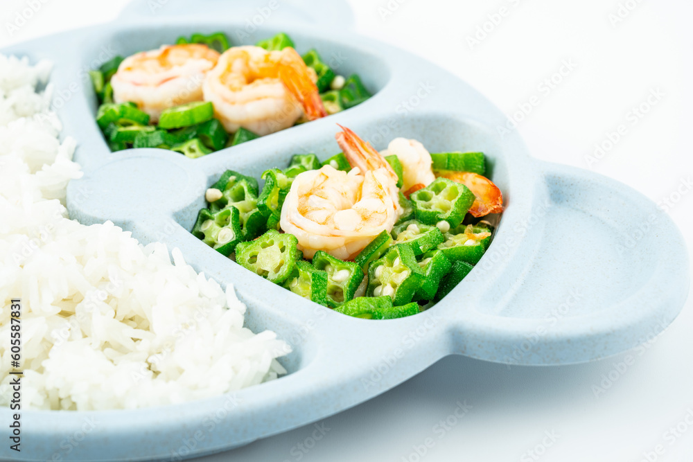 A plate of nutritious meals for kids, fried okra with shrimp and rice