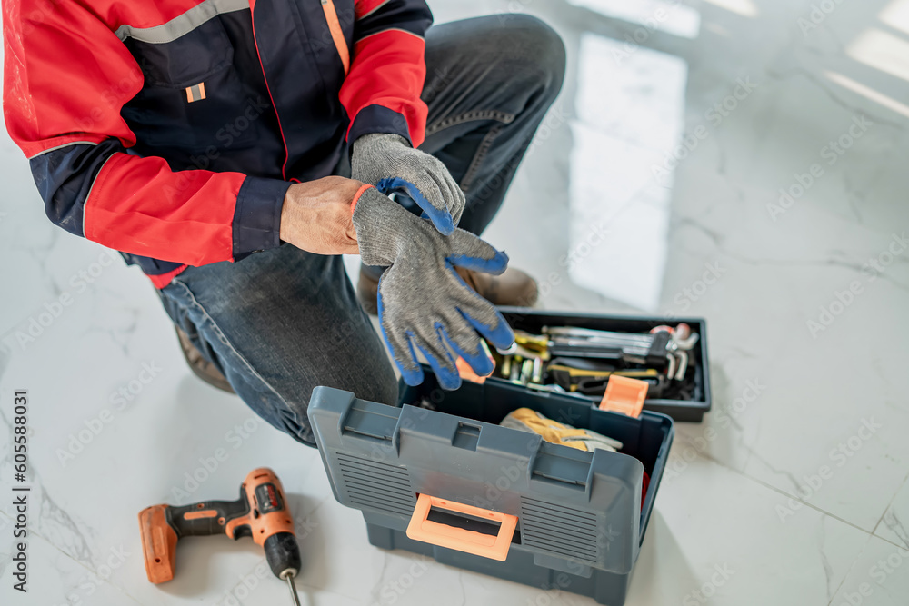 Civil engineer working with digital laser level tool in home interior design Civil engineer working with digital laser level tool in home interior design