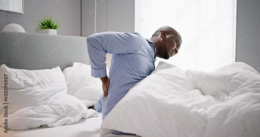 Man Sitting On Bed Suffering Man Sitting On Bed Suffering