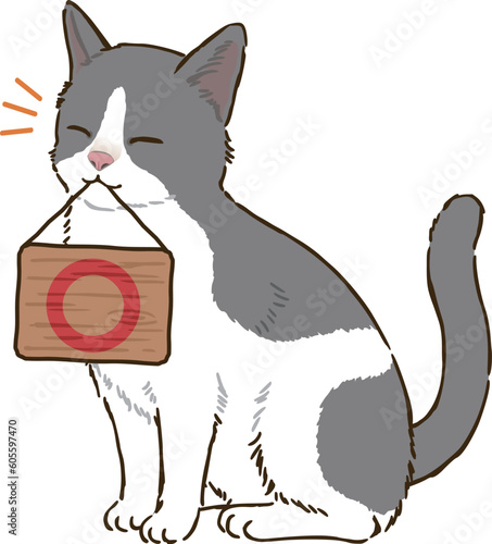 丸マークを描いた看板を咥える猫（バイカラー）