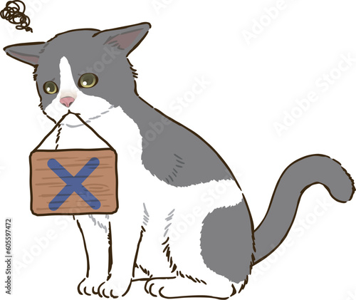 バツマークを描いた看板を咥える猫（バイカラー）