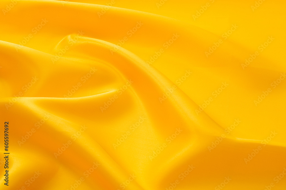 Obraz premium Close up of yellow silk background