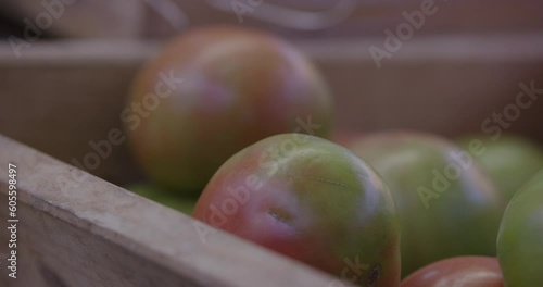 
Assorted fruit, vegetables and fish in wooden baskets at village market