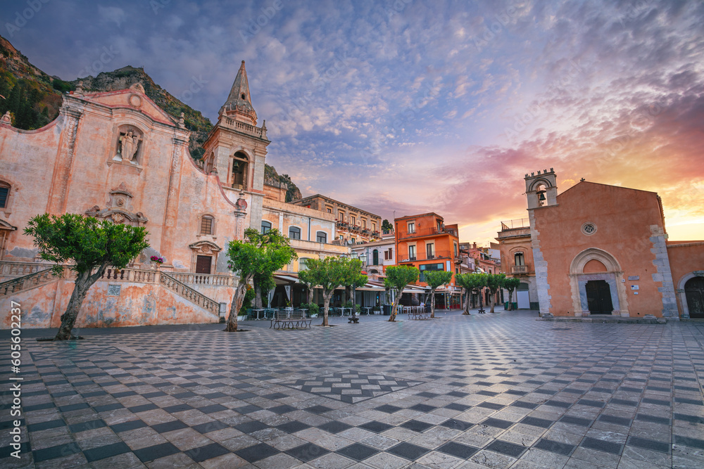 Taormina, Sicily, Italy. Cityscape image of picturesque town of Taormina, Sicily with main square Piazza IX Aprile and San Giuseppe church at sunrise.