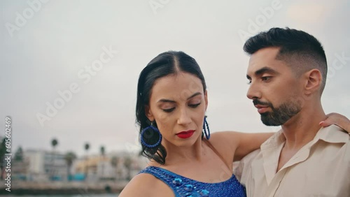 Professional dancers performing hot rumba outdoors close up. Sexy couple dancing