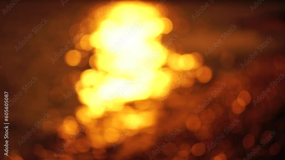 Blurred golden sea at sunset with shifting focus and bokeh effect. Sun reflects and sparkles on waves, illuminating golden sea. Holiday recreation concept. Abstract nautical summer ocean sunset nature Blurred golden sea at sunset with shifting focus and bokeh effect. Sun reflects and sparkles on waves, illuminating golden sea. Holiday recreation concept. Abstract nautical summer ocean sunset nature