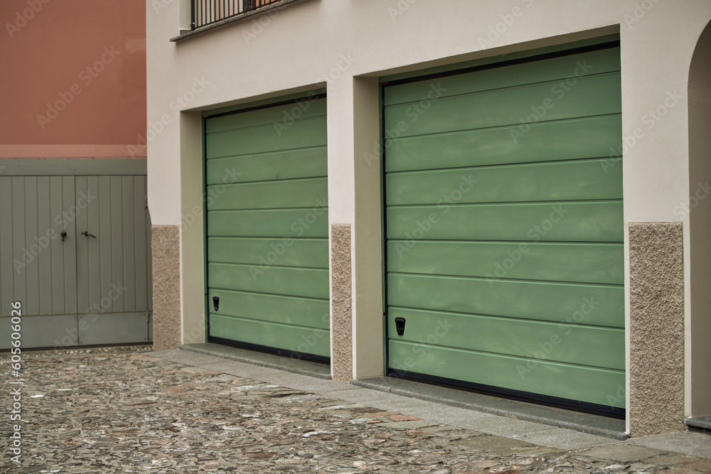 Exterior view of a beautiful house with garage gate. Exterior view of a beautiful house with garage gate.
