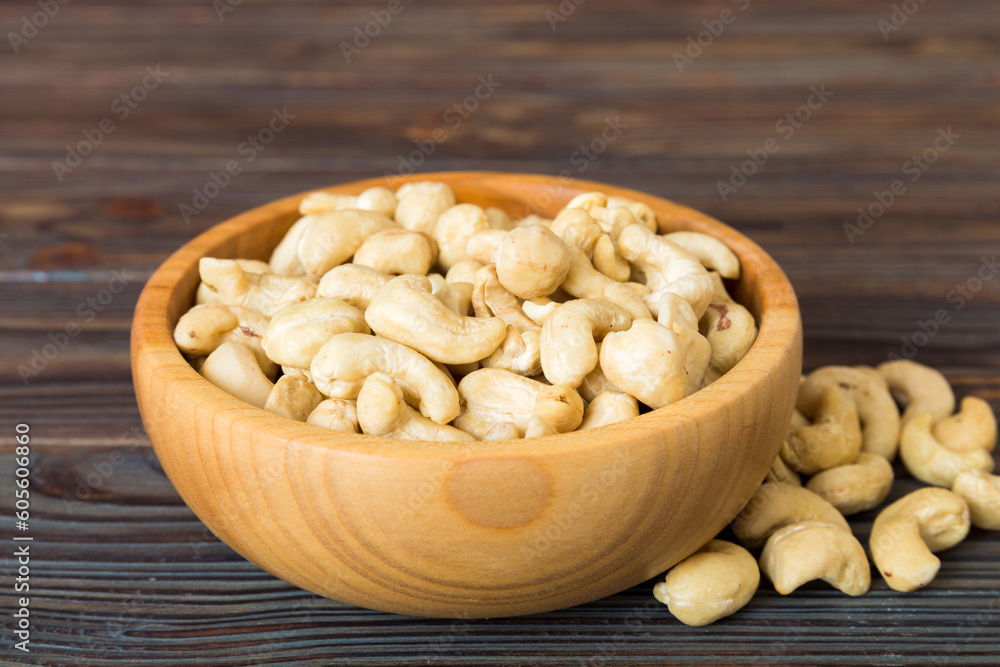 cashew nuts in wooden bowl on table background. top view. Space for text Healthy food cashew nuts in wooden bowl on table background. top view. Space for text Healthy food