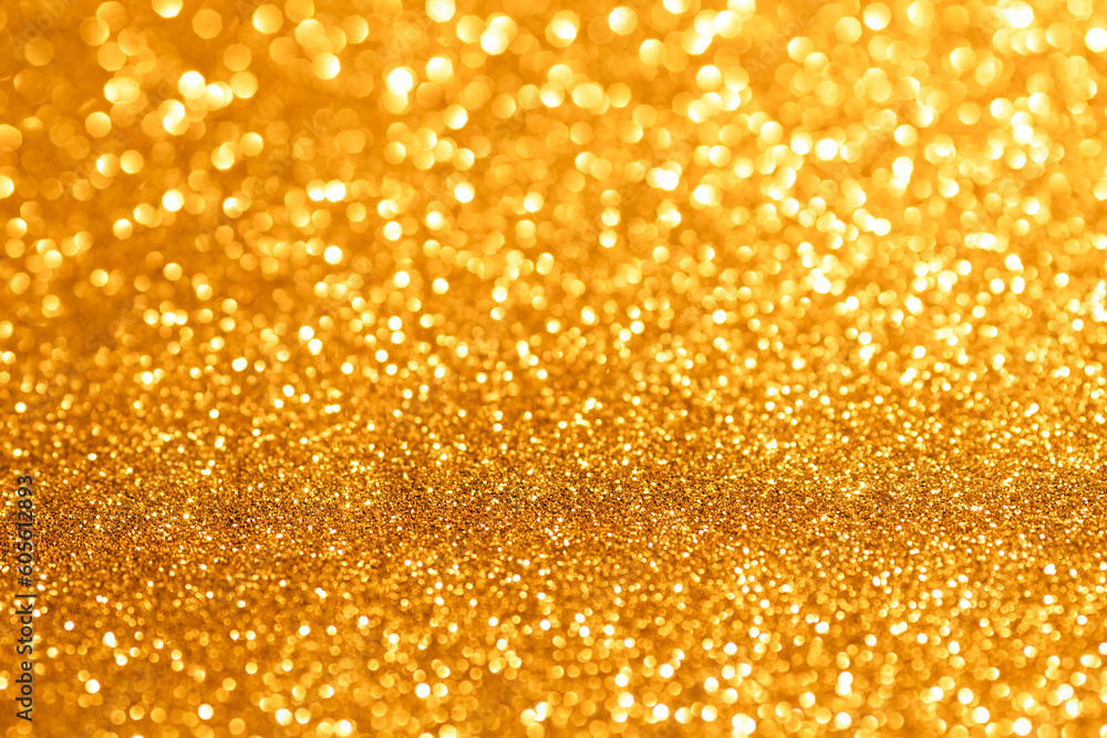 Golden glittering background for design and free space.