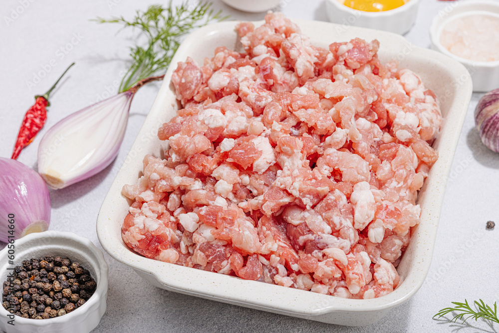 Raw minced meat, spices and herbs. Traditional ingredients for cooking cutlets or meatballs Raw minced meat, spices and herbs. Traditional ingredients for cooking cutlets or meatballs