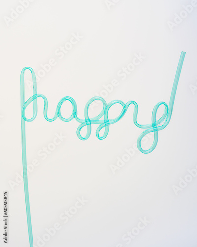 happy aqua script straw on white background photo