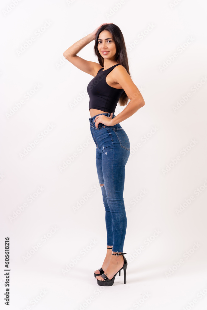 Brunette woman on a white background, casting studio photos, jeans and black t-shirt Brunette woman on a white background, casting studio photos, jeans and black t-shirt