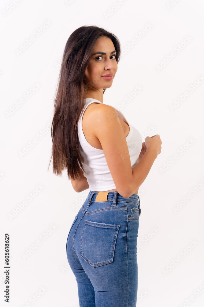Brunette woman on a white background, casting studio photos, portrait in white t-shirt in profile smiling Brunette woman on a white background, casting studio photos, portrait in white t-shirt in profile smiling