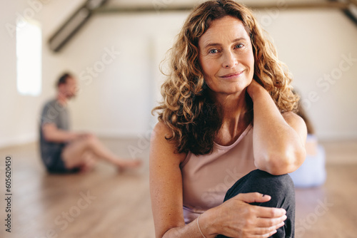 Portrait of a senior woman sitting in a yoga studio