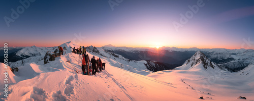 people hiking in winter, ski touring, ski, celebrating at the summit, sunrise time, snow © Camille