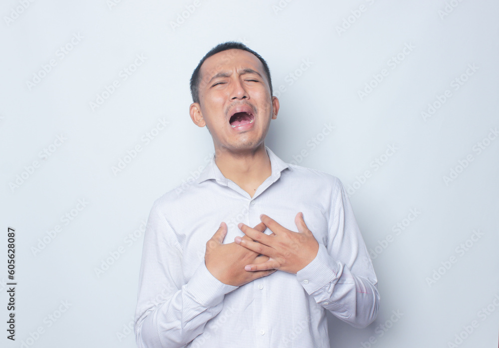 Crying expression asian young man in white shirt. Crying expression asian young man in white shirt.