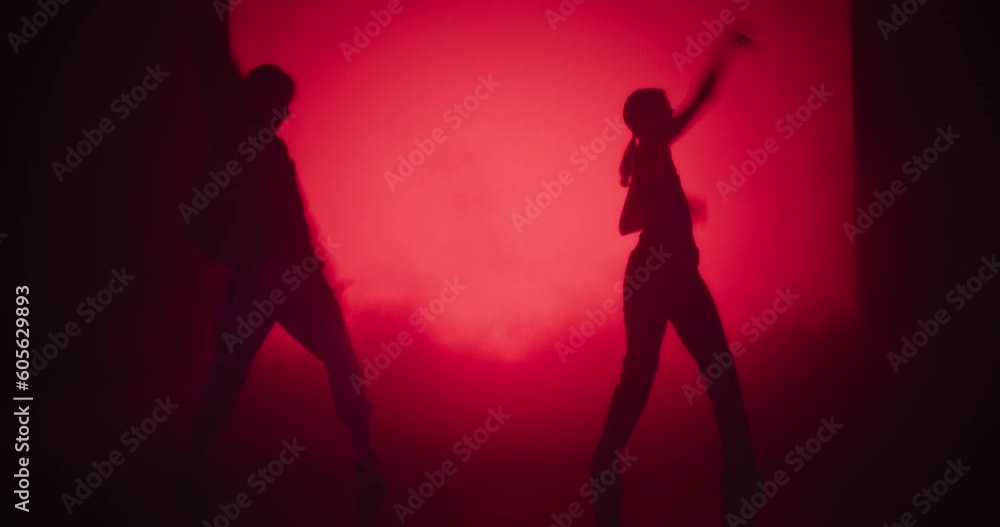 Talented Young Male and Female Dancers Engage in a Captivating Modern Dance Choreography, Dressed in Elegant White Attire, Performing Against a Big Screen with Changing Colors Talented Young Male and Female Dancers Engage in a Captivating Modern Dance Choreography, Dressed in Elegant White Attire, Performing Against a Big Screen with Changing Colors