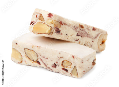 Pieces of delicious nougat on white background photo