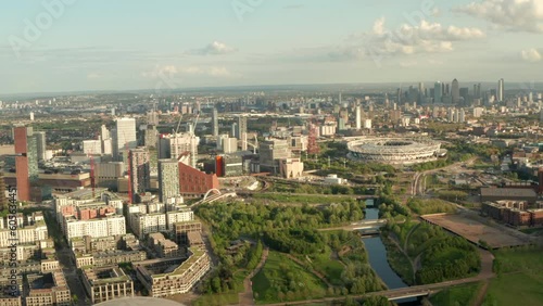 Dolly back aerial shot over Olympic park and Stratford east London photo