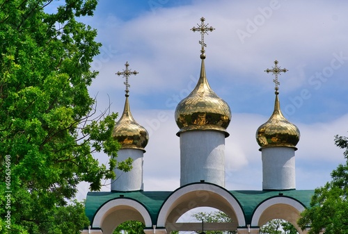 Three golden domes of a Russian orthodox Christian church photo