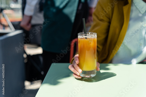 Woman ready to drink Iced bumble Coffee. Summer trendy refreshing coffee drink