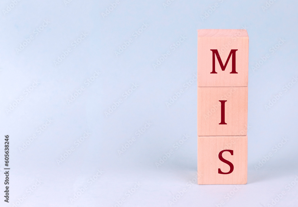 MIS on wooden cubes on a blue background MIS on wooden cubes on a blue background