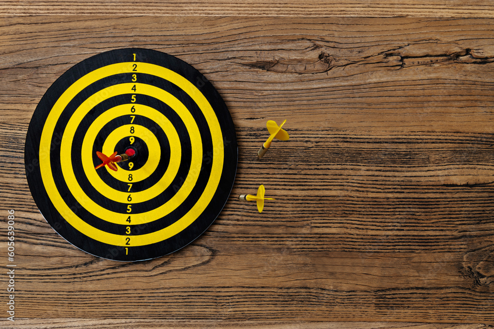 Some darts miss target center Some darts miss target center
