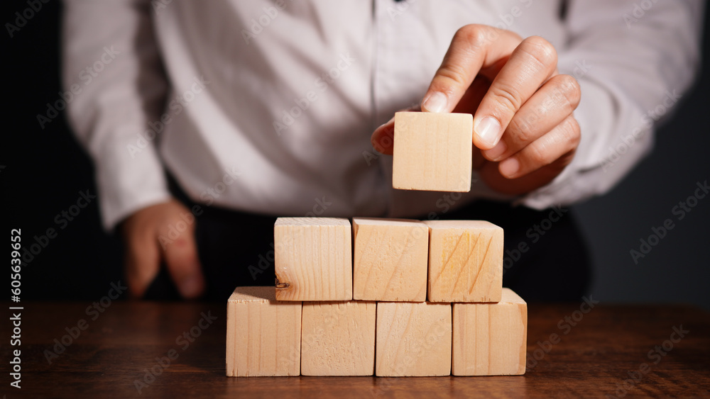 business man index finger touching wooden box business man index finger touching wooden box