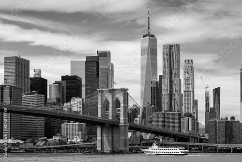 Monochrome shot of the Brooklyn Bridge and New York skyline across the East River