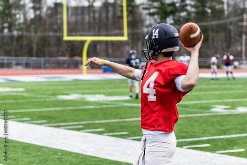 Young football player throwing a ball