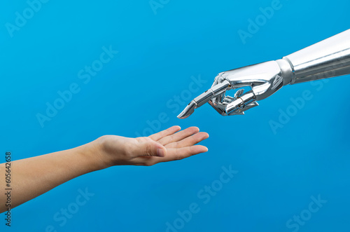 Human hand touching robot finger