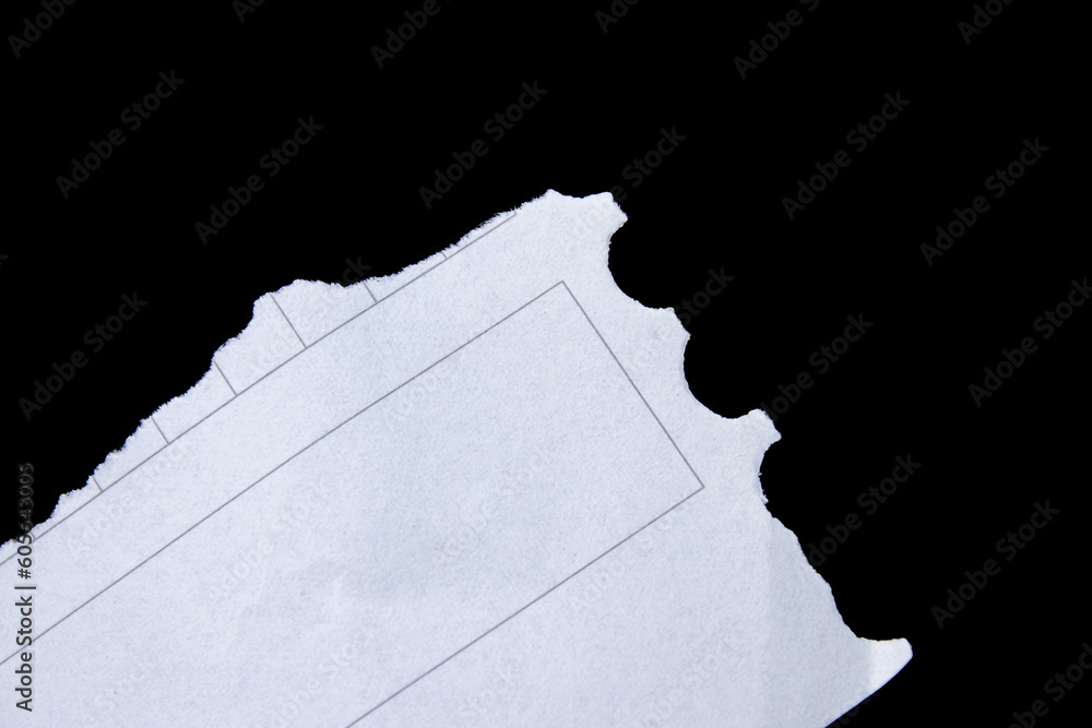 White ripped paper on black background. Torn paper background with copy space. White ripped paper on black background. Torn paper background with copy space.