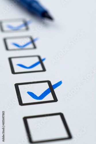 Принти на полотні Blue pen marking on checklist sheet