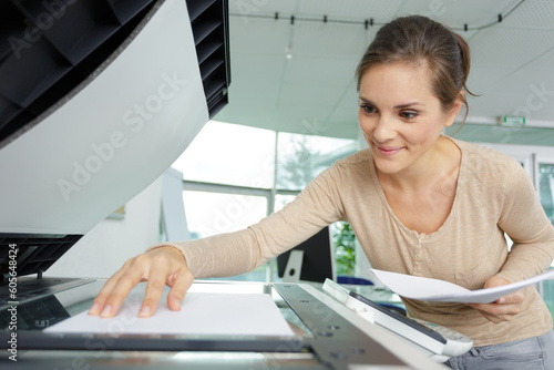 portrait of woman at photocopier photo