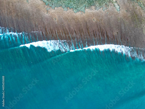 Aerial top view of amazing waves in Bali - Indonesia.