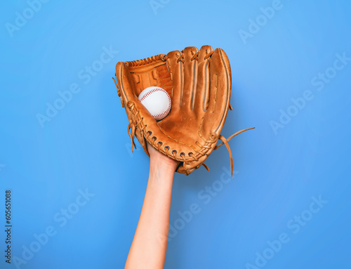 Leather baseball glove caught a baseball for the game photo