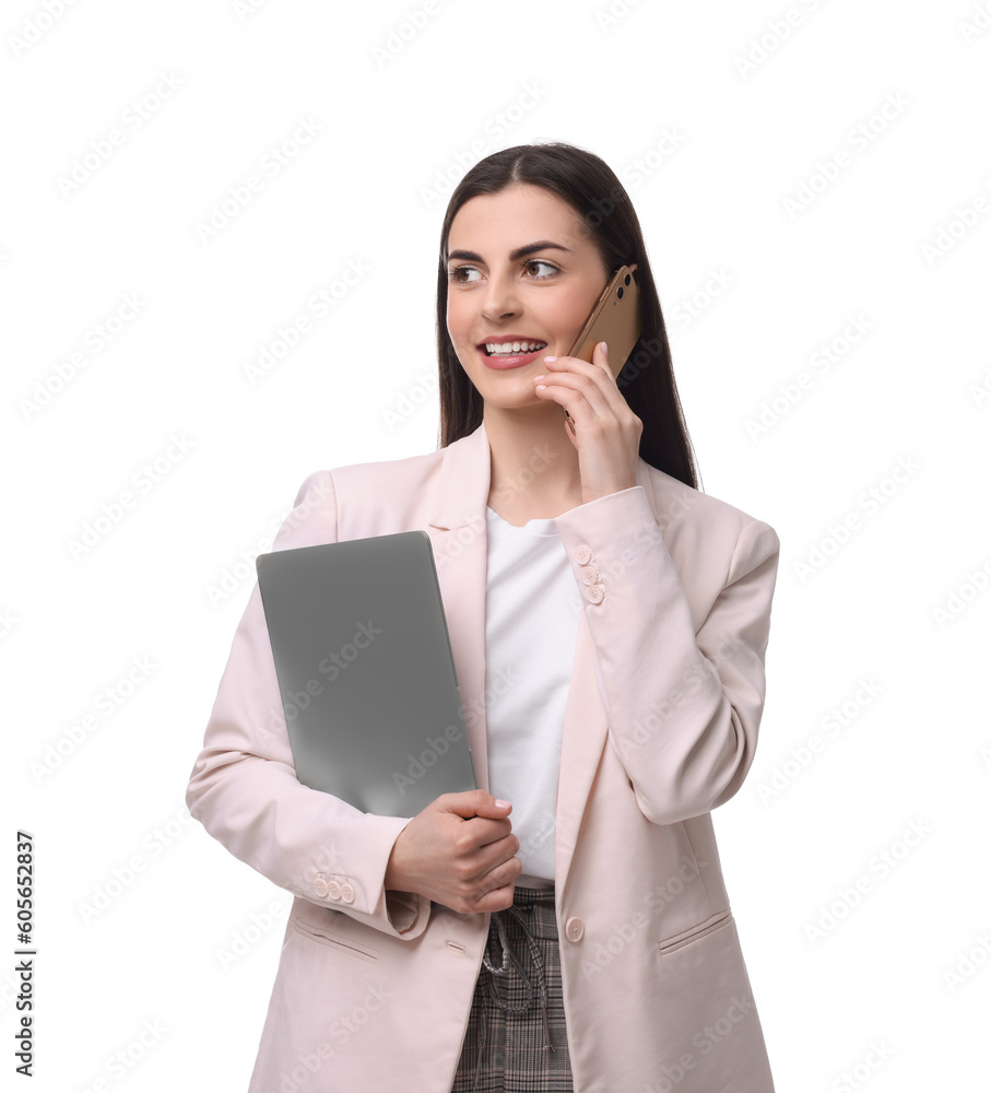 Beautiful businesswoman with laptop talking on smartphone against white background Beautiful businesswoman with laptop talking on smartphone against white background
